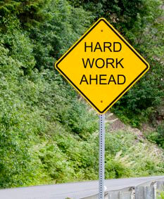 Hard work ahead road sign pic