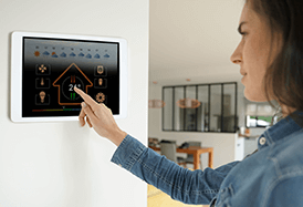 woman controlling devices in her home using a smart home system