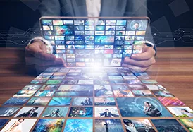 person holding tablet reflecting multiple video streams on a table