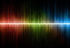 Colored sound wave on a black background, with pulses of blue green and red colors. Bright sound waves.